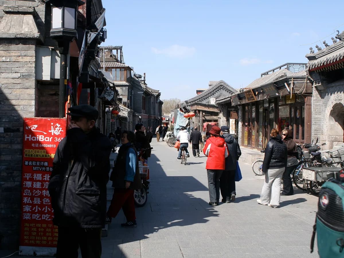 A lived-in hutong street with bicycles and courtyard homes in Beijing