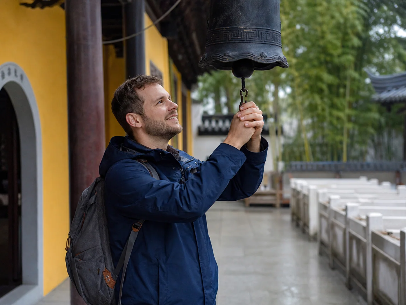 Visitor ringing temple bell