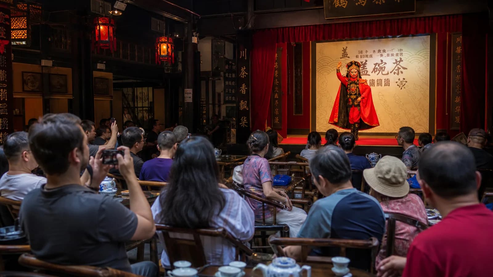Travelers watching Sichuan opera