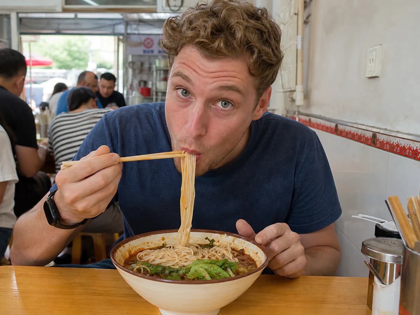 Traveler eating spicy breakfast noodles