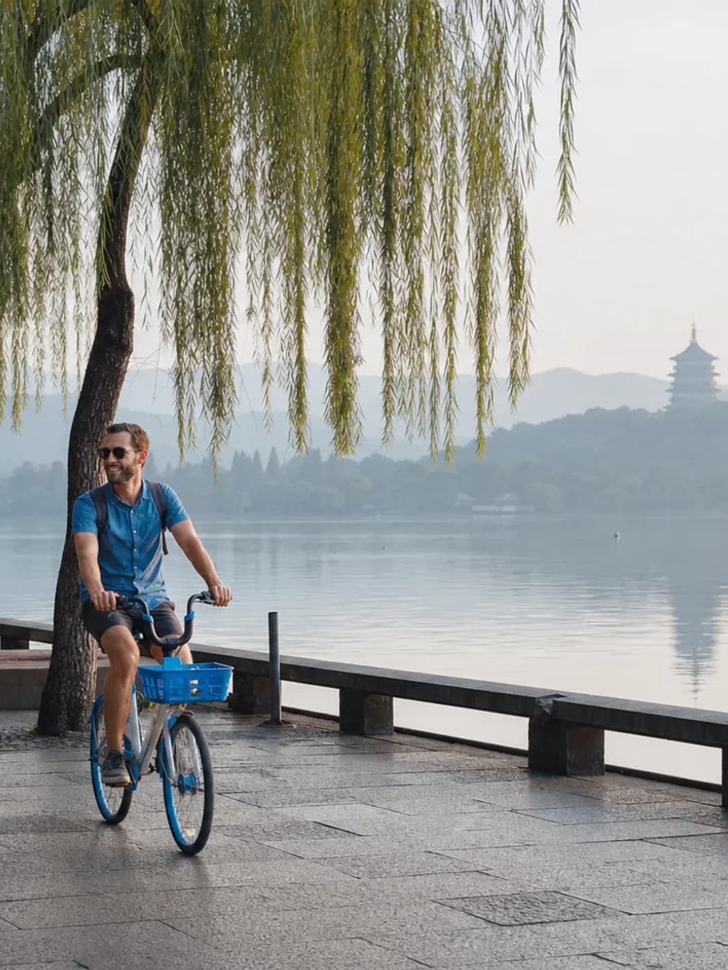 Cyclists on Hangzhou lake path