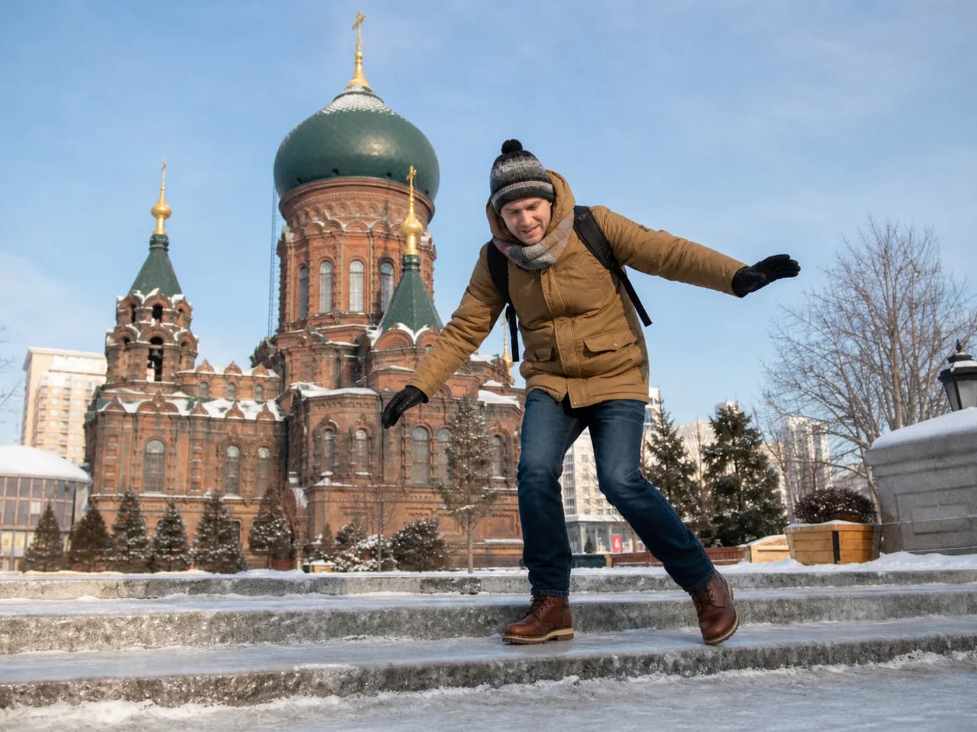 Traveler navigating icy steps in Harbin
