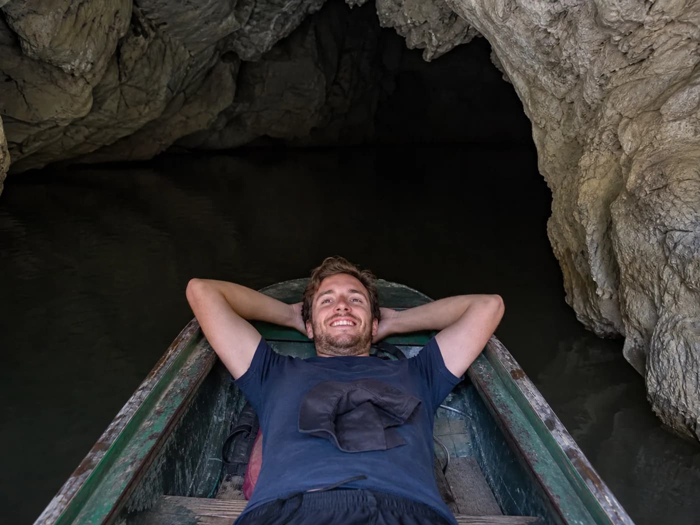 Travelers on cave entry boat