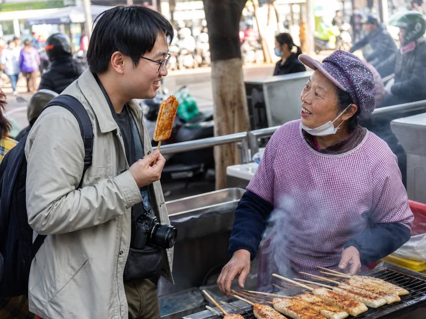 Traveler eating rice cake skewer