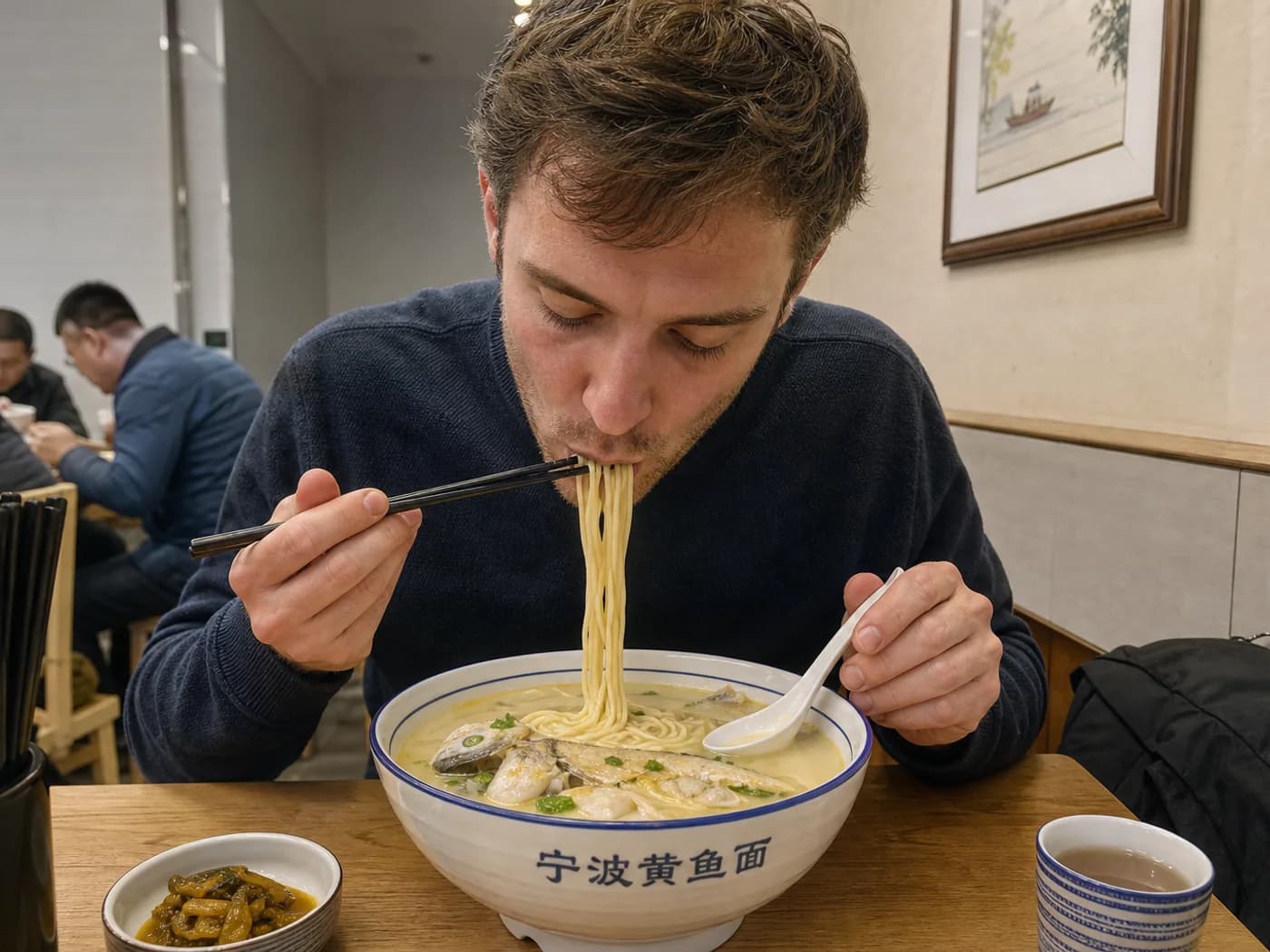 Traveler eating fish noodles