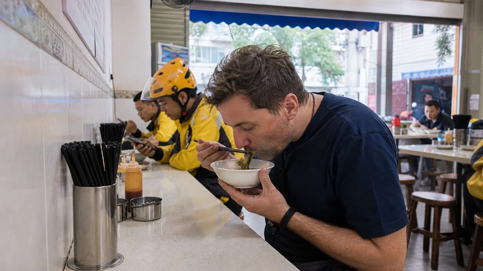 Traveler eating beef soup breakfast