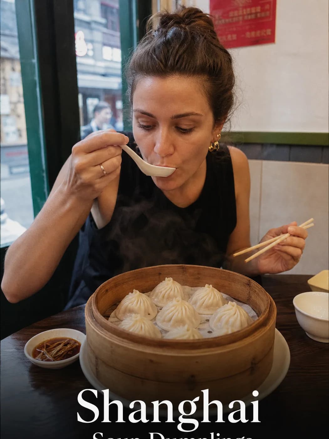 Traveler eating xiaolongbao carefully