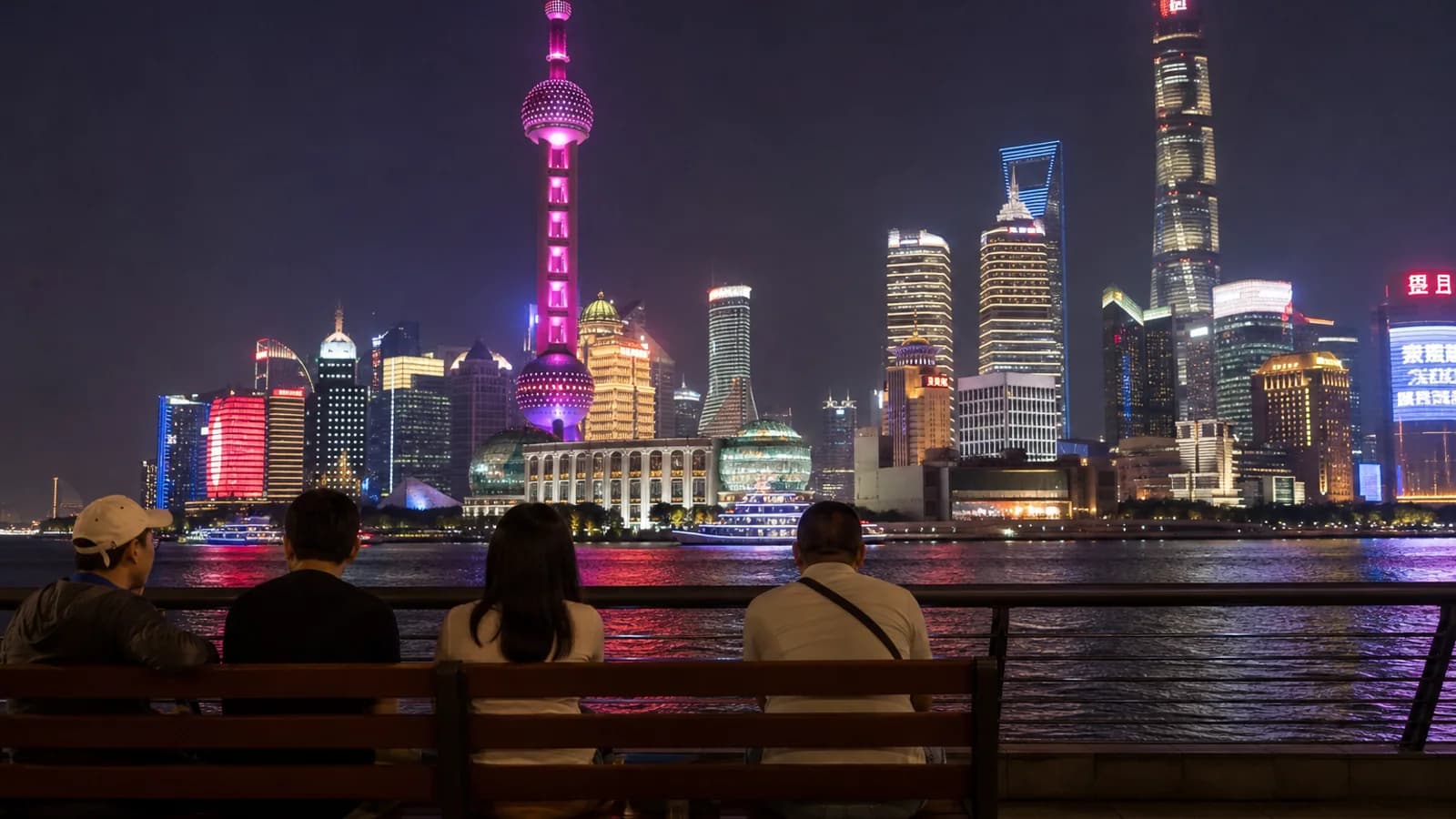 Travelers watching Shanghai skyline at night