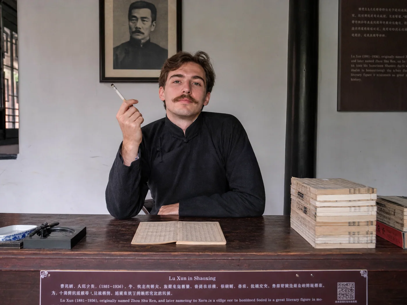 Visitor at historic writing desk