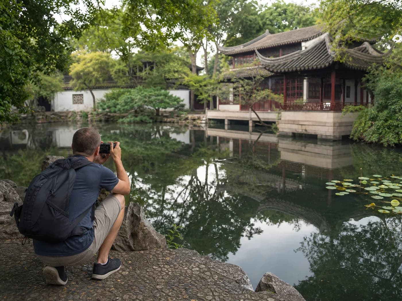 Visitor framing garden reflection