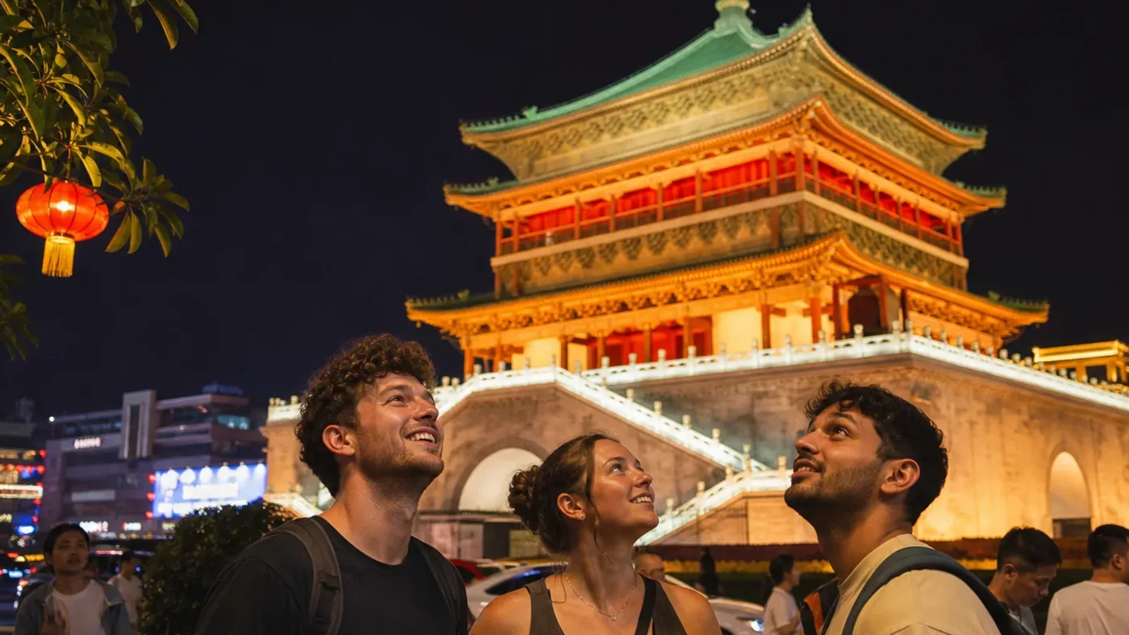 Travelers at illuminated tower